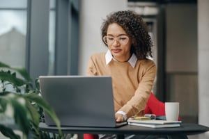 Image of woman working on laptop
